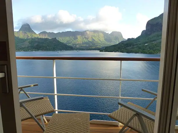 A view of Opunohu Bay and surrounding landscape in Moorea, French Polynesia, from a cruise ship balcony. 