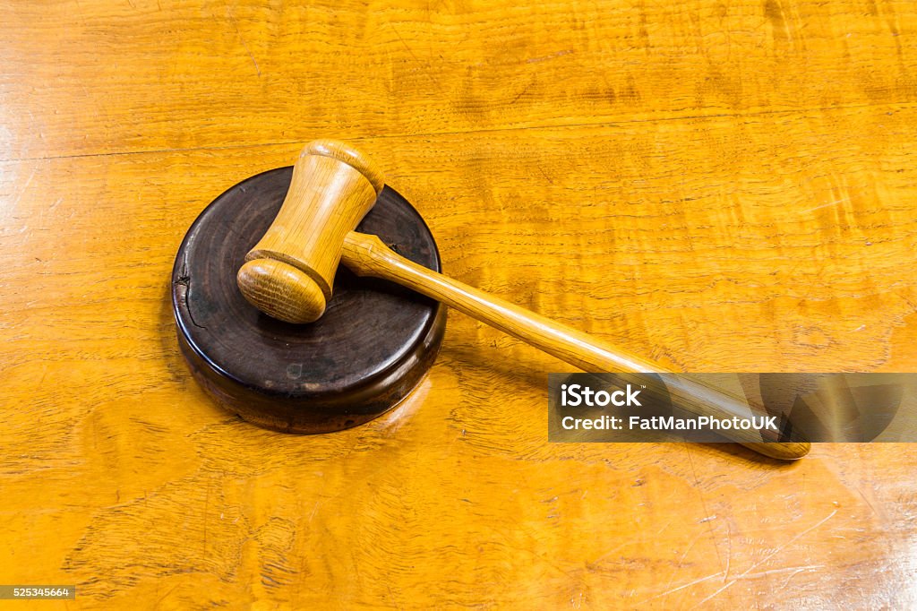 Hammer and gavel Wooden hammer on gavel, on wood desk. Auction Stock Photo