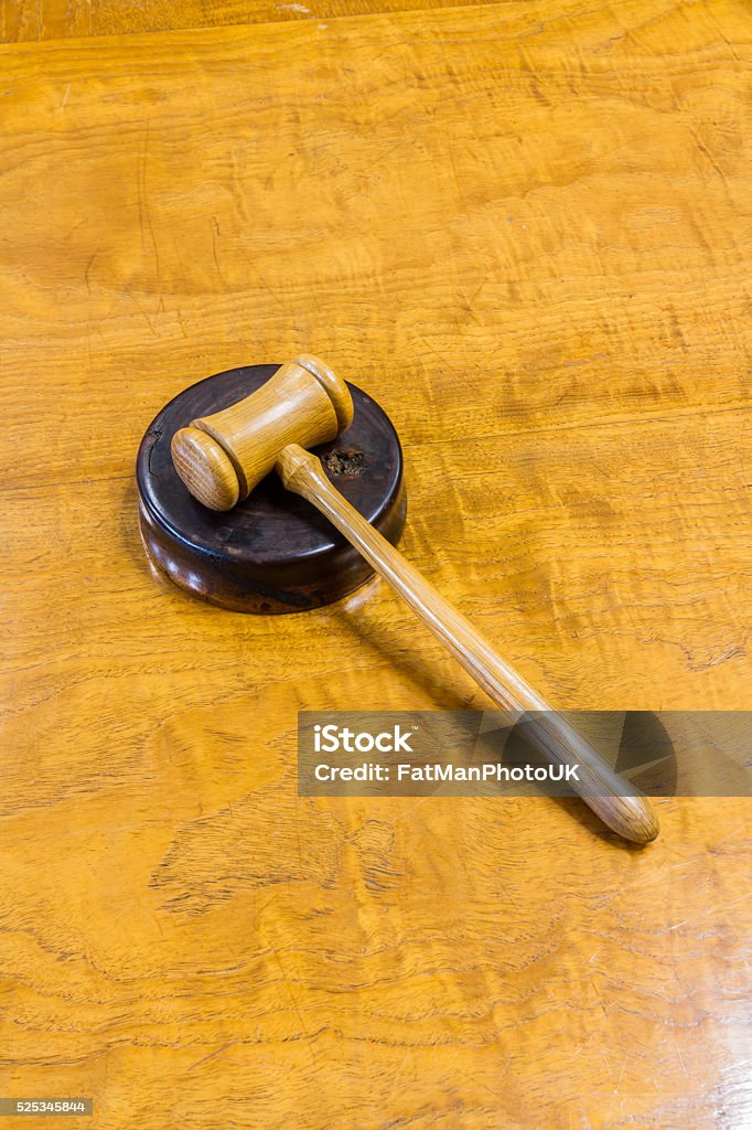 Hammer and gavel Wooden hammer on gavel, on wood desk. Auction Stock Photo