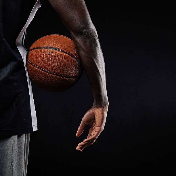istock Basketball in hand of a young player 525345959