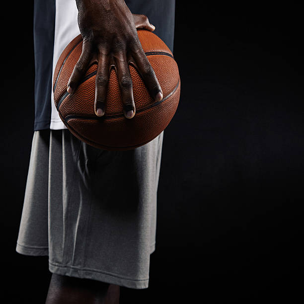 istock African basketball player holding ball 525345965