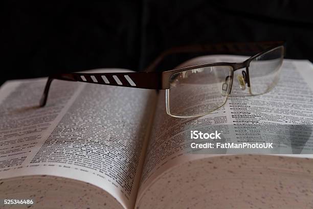 Glasses On Dictionary Stock Photo - Download Image Now - Book, Close-up, Cyrillic Script