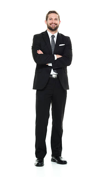 istock Smiling businessman standing with arms crossed 525348756