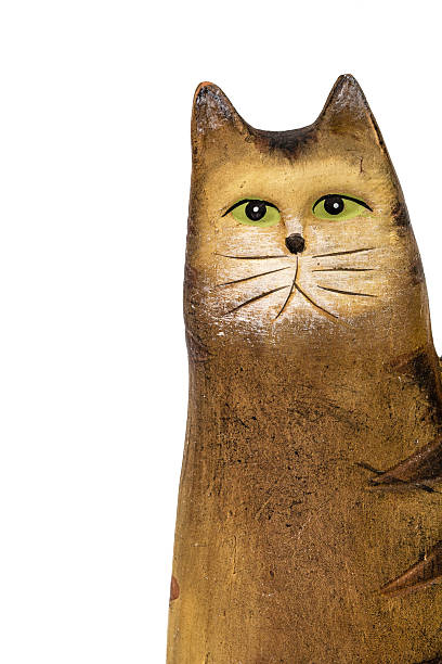 istock Ceramic figurine of a cat, isolated on white background 525349144