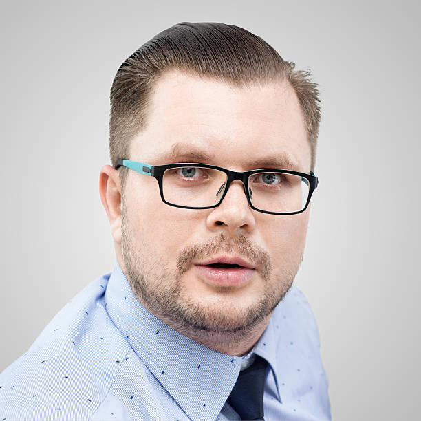 istock young surprised businessman over gray background 525349510