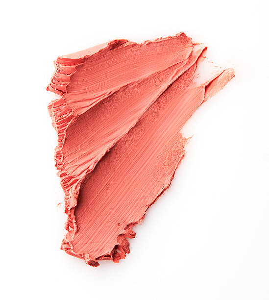 istock Nude colour lipstick stroke on white paper 525350196