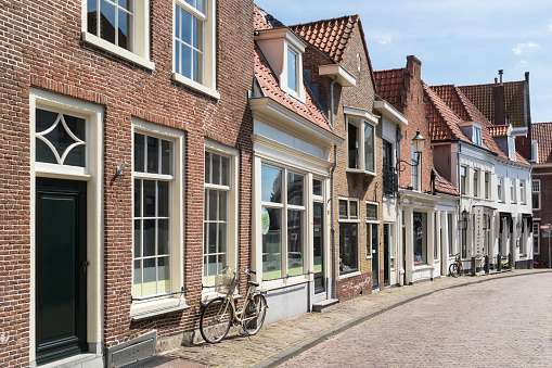 Amersfoort, Netherlands - June 15, 2015: Street with row of historic houses in old town of Amersfoort in Utrecht province, Netherlands