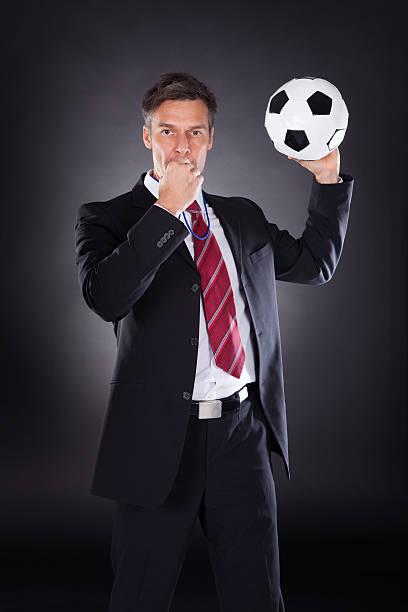 istock Businessman Carrying Football 525350937