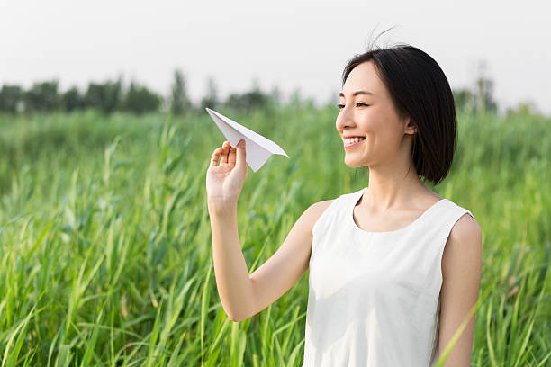 istock girl hands holding model airplane 525351162
