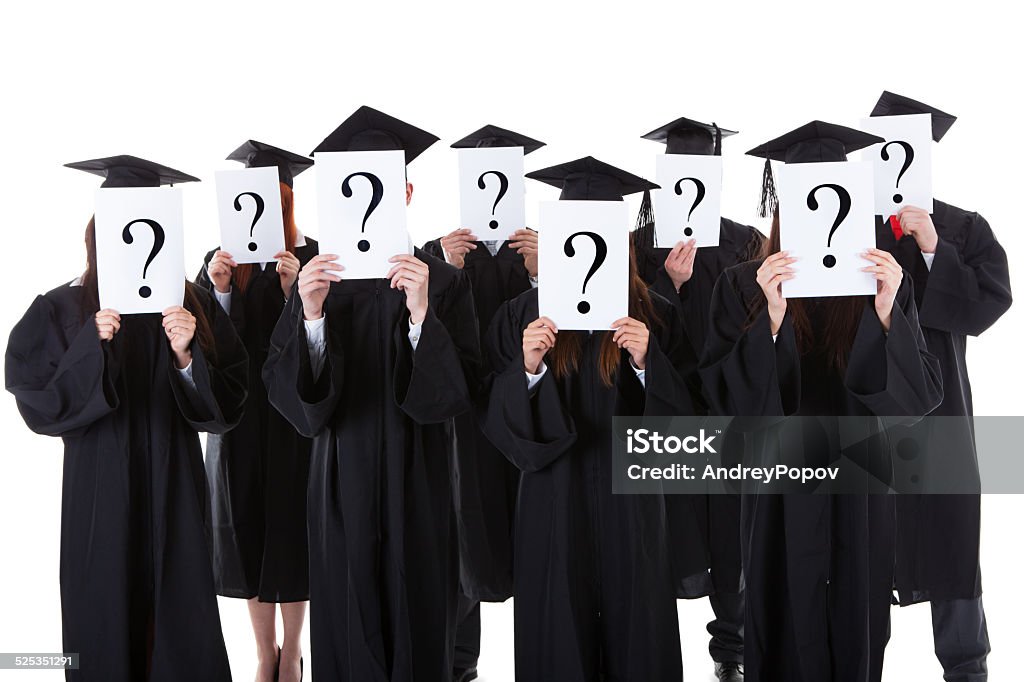Graduate students showing question signs Graduate students covering face with question signs. Isolated on white Adult Stock Photo