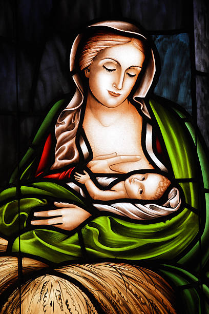 Baby Jesus and Mother Mary depicted in a stained glass window.