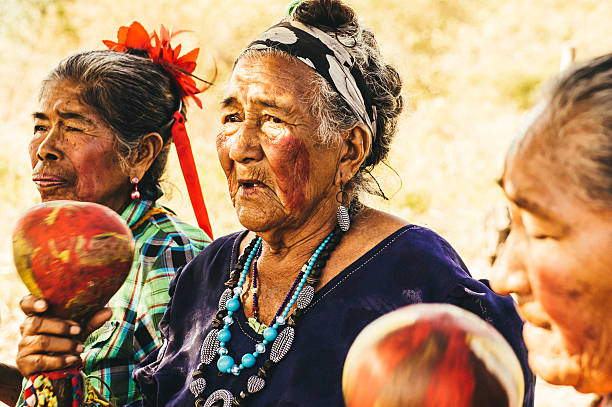 Old Paraguayan indigenous women performing a song stock photo