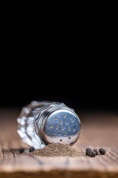istock Pepper Shaker on wooden background 525352344