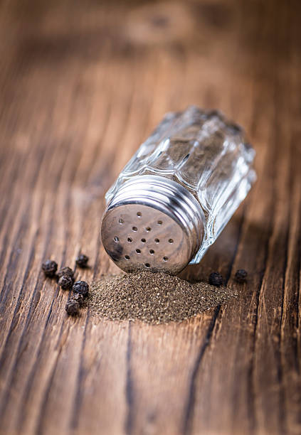 istock Old wooden table with a Pepper Shaker 525352406