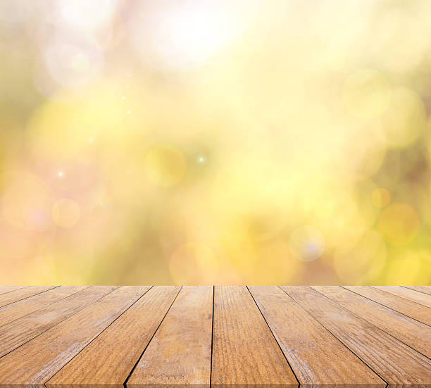 istock Wood table top and autumn bokeh background 525352648
