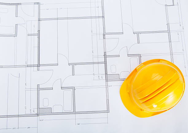 istock Close-up Of Blue Print And Hard Hat 525353217