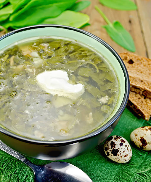 istock Soup green of sorrel and spinach on board with eggs 525353407