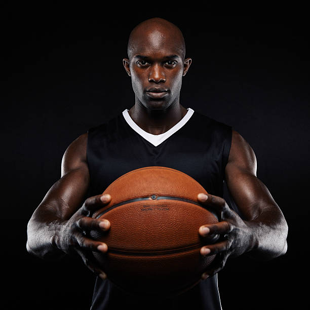 istock Muscular young basketball player with a ball 525353499