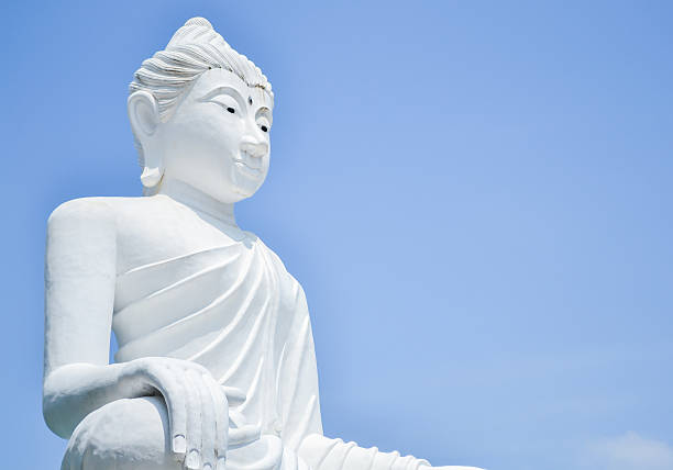 istock White Buddha statue in Thailand 525355319