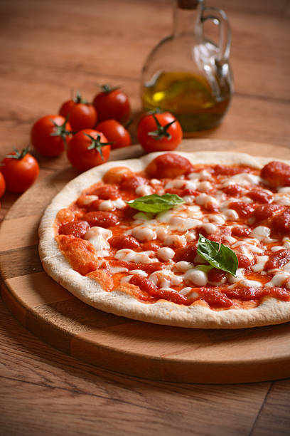 istock Pizza margherita in the cutting board 525355338