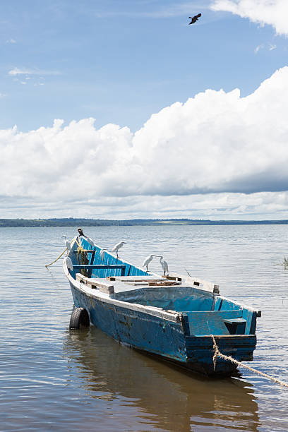 Two men in a boat, fishing at Lake Victoria.