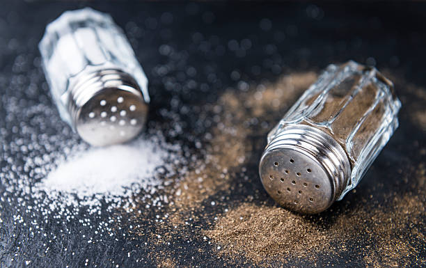 istock Salt and Pepper Shakers on a slate slab 525356626