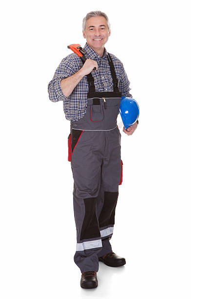 istock Mature Man Holding Wrench 525356727