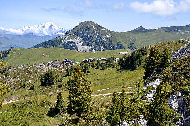 Plagne Villages in France Mountain of La Plagne in the French Alps and snowy Mont Blanc massif in the background,commune in the Tarentaise Valley, Savoie department and Rhône-Alpes region, in France la plagne photos stock pictures, royalty-free photos & images