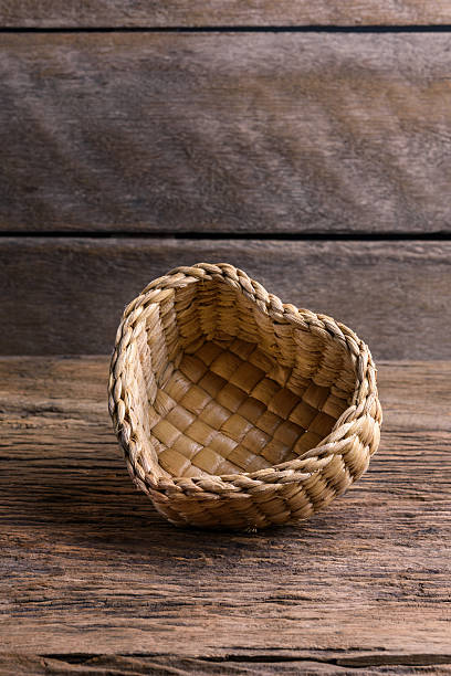 bamboo basket, Wicker basket of  Heart Shape bamboo basket, Wicker basket  of  Heart Shape on wooden background interlace format stock pictures, royalty-free photos & images