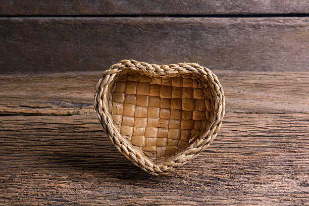 bamboo basket, Wicker basket of  Heart Shape bamboo basket, Wicker basket  of  Heart Shape on wooden background interlace format stock pictures, royalty-free photos & images