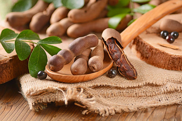 Tamarind Fruit On The Table Stock Photo - Download Image Now - Tamarind,  Fruit, Backgrounds - iStock