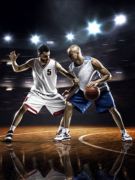 istock Two basketball players in action 525363779