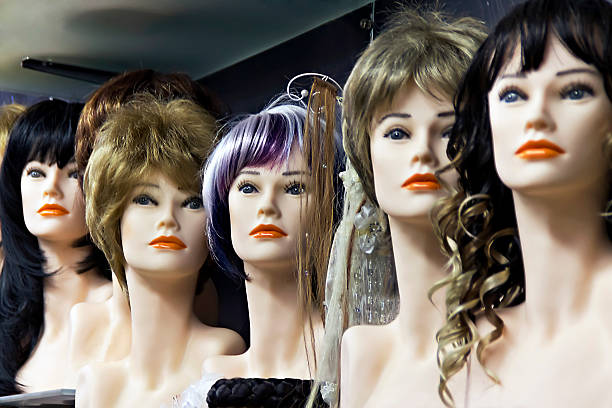 istock Several female mannequins with wigs 525363963