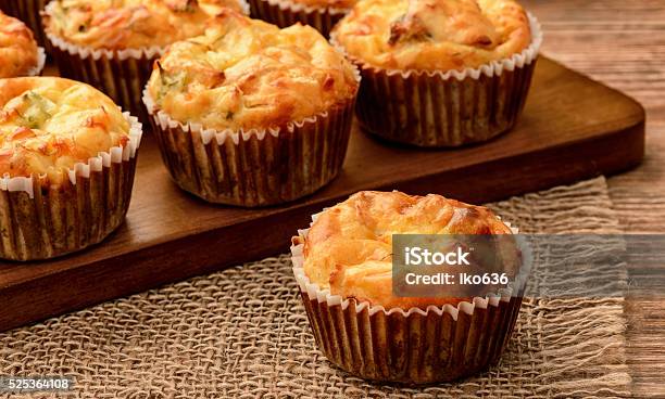 Homemade Muffins With Chicken And Cheese On Brown Wooden Board Stock Photo - Download Image Now