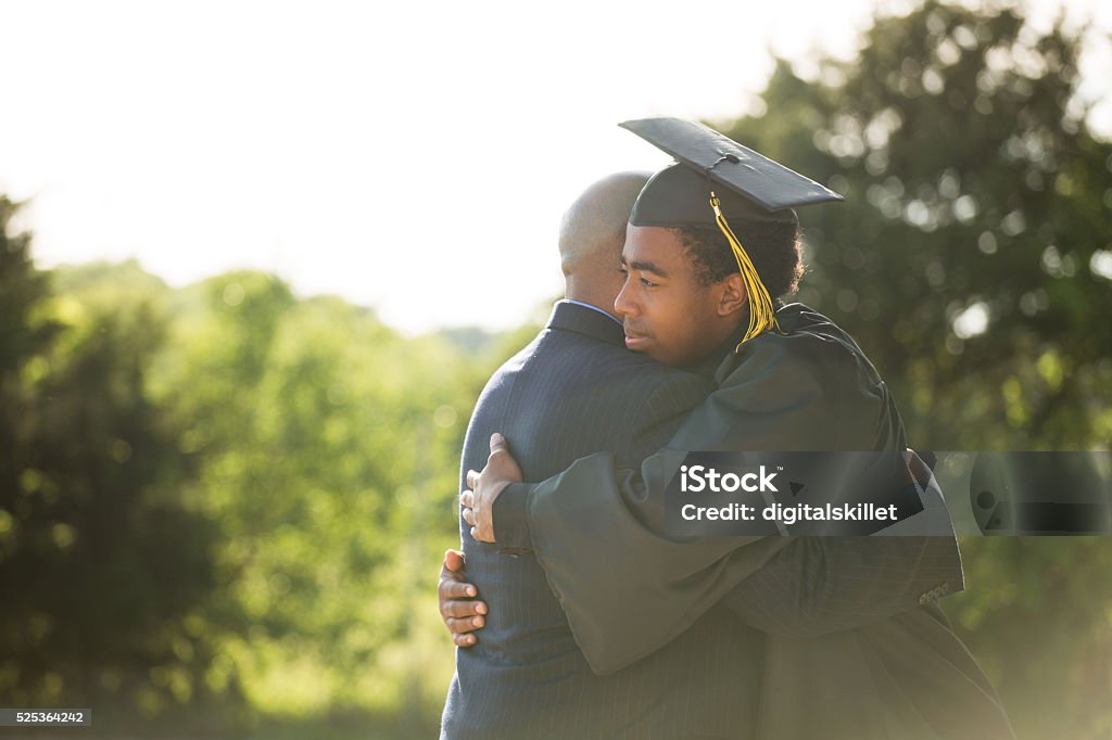 African American Father and son on Graduation Day African American Father hugging his son graduation day Graduation Stock Photo