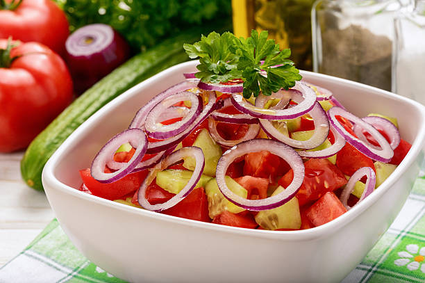 istock Vegetabale salad with tomatoes, cucumbers and onion. 525364252