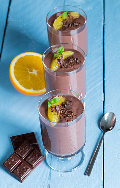 Chocolate pudding dessert with orange and pistachio