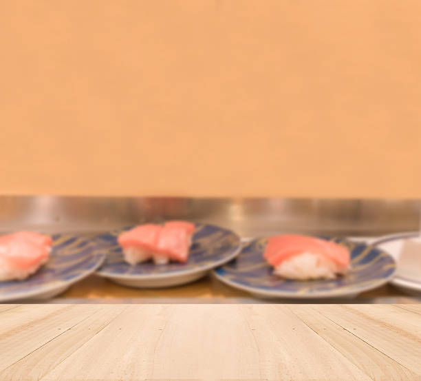 Wooden table top with Blurred sushi background