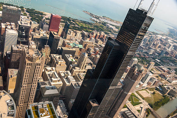 Chicago Aerial Flying by the Sears Tower in Chicago.  willis tower stock pictures, royalty-free photos & images