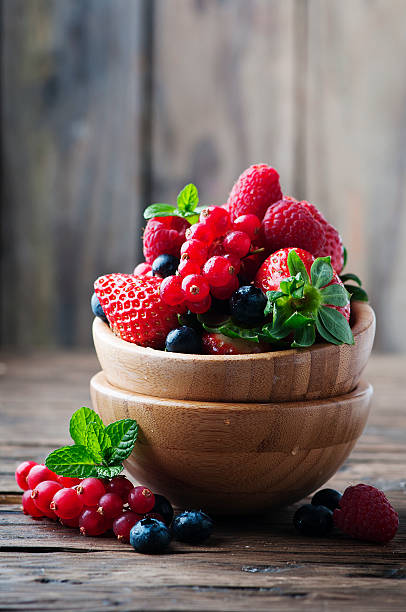 istock Mix of berry on the wooden table 525367600