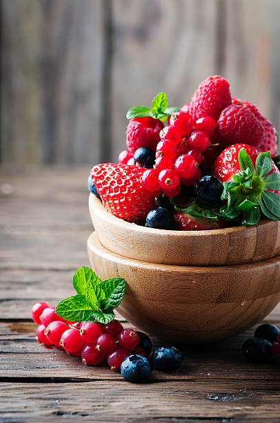 istock Mix of berry on the wooden table 525367714
