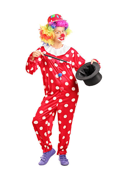 istock Female clown holding a magician hat 525368161