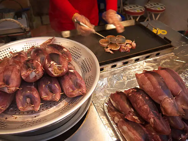 Preparing Stufferd squid on the korean fishmarket