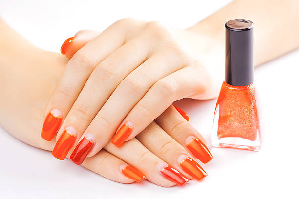 istock manicure. applying red nail polish. isolated 525370623