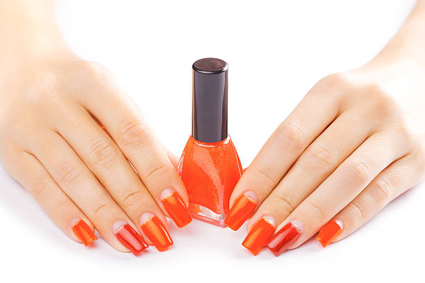 istock manicure. applying red nail polish. isolated 525370801
