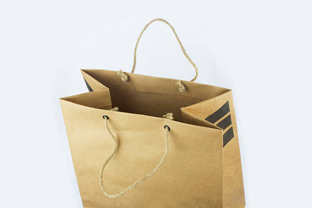 istock Brown paper bag isolated on white background 525381269