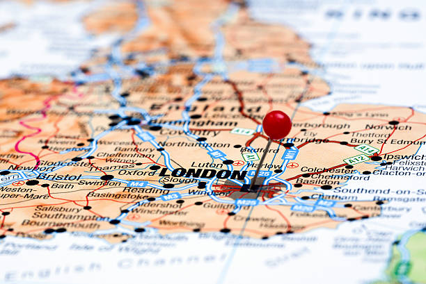London pinned on a map of europe Photo of pinned London on a map of europe. May be used as illustration for traveling theme. experiential travel stock pictures, royalty-free photos & images