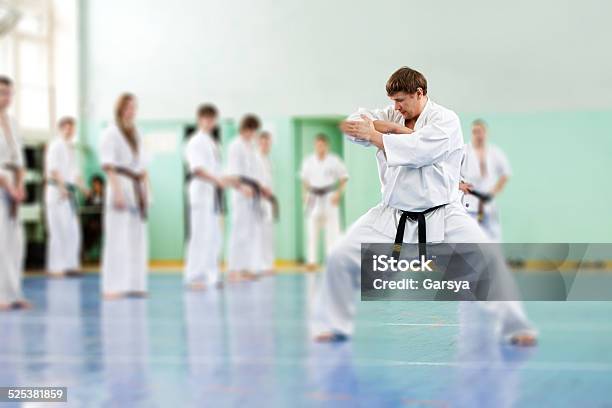 Lesson In Karate School Stock Photo - Download Image Now - Karate, Learning, Men