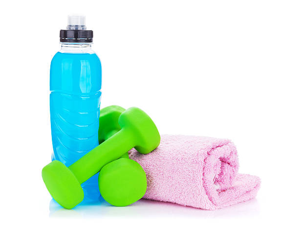 istock Two green dumbells, drink bottle and towel 525383331