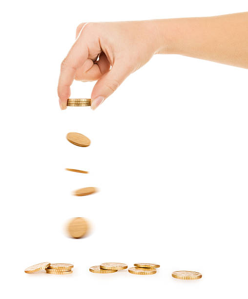 istock Falling Golden Coins Isolated on white background 525383341